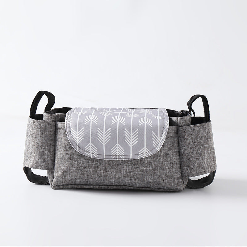 Gray fabric bag with a white patterned flap on a light gray background